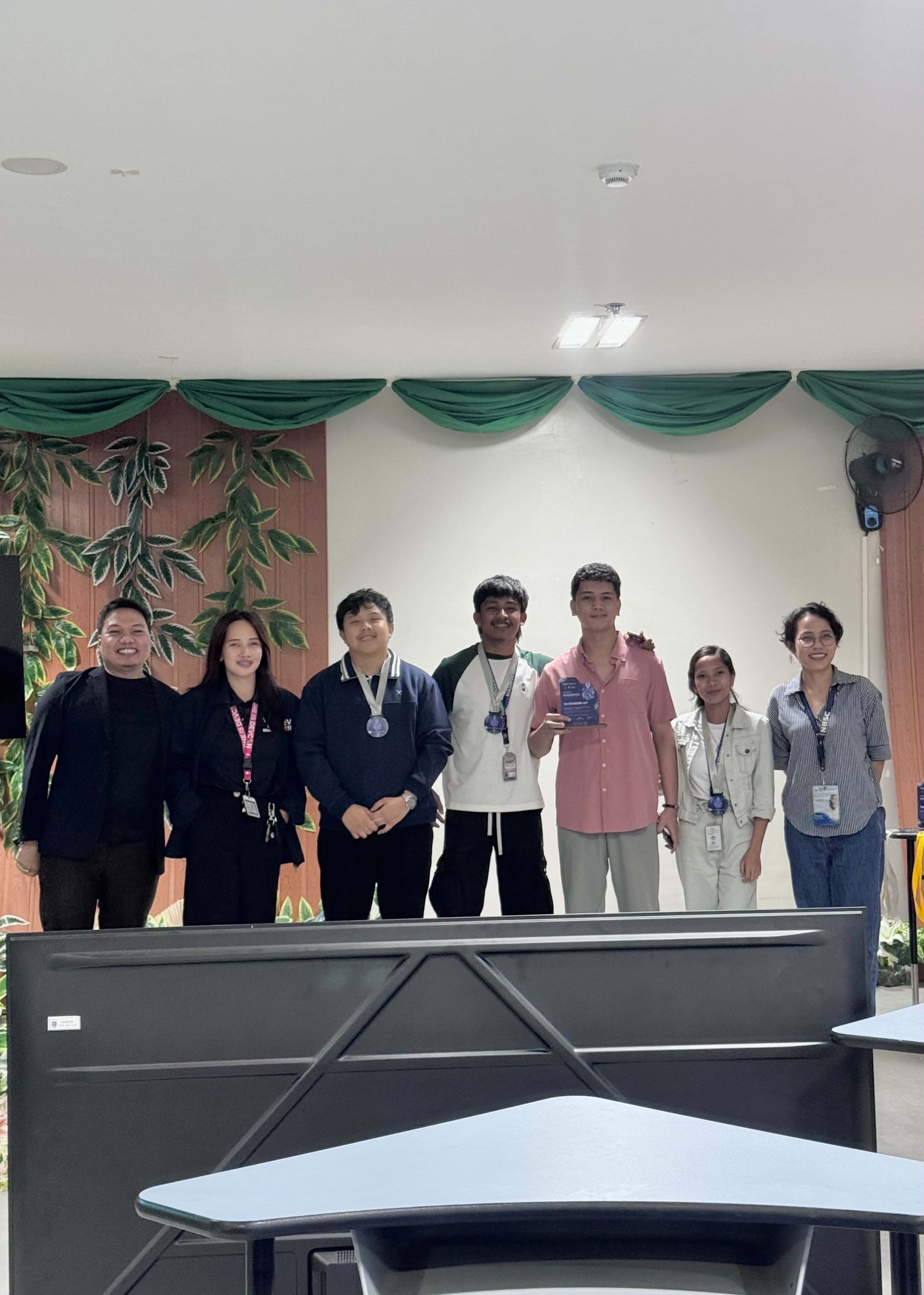 Lyle Agreda and the PromptPulse team with DevCon Bukidnon organizers at Northern Bukidnon State College