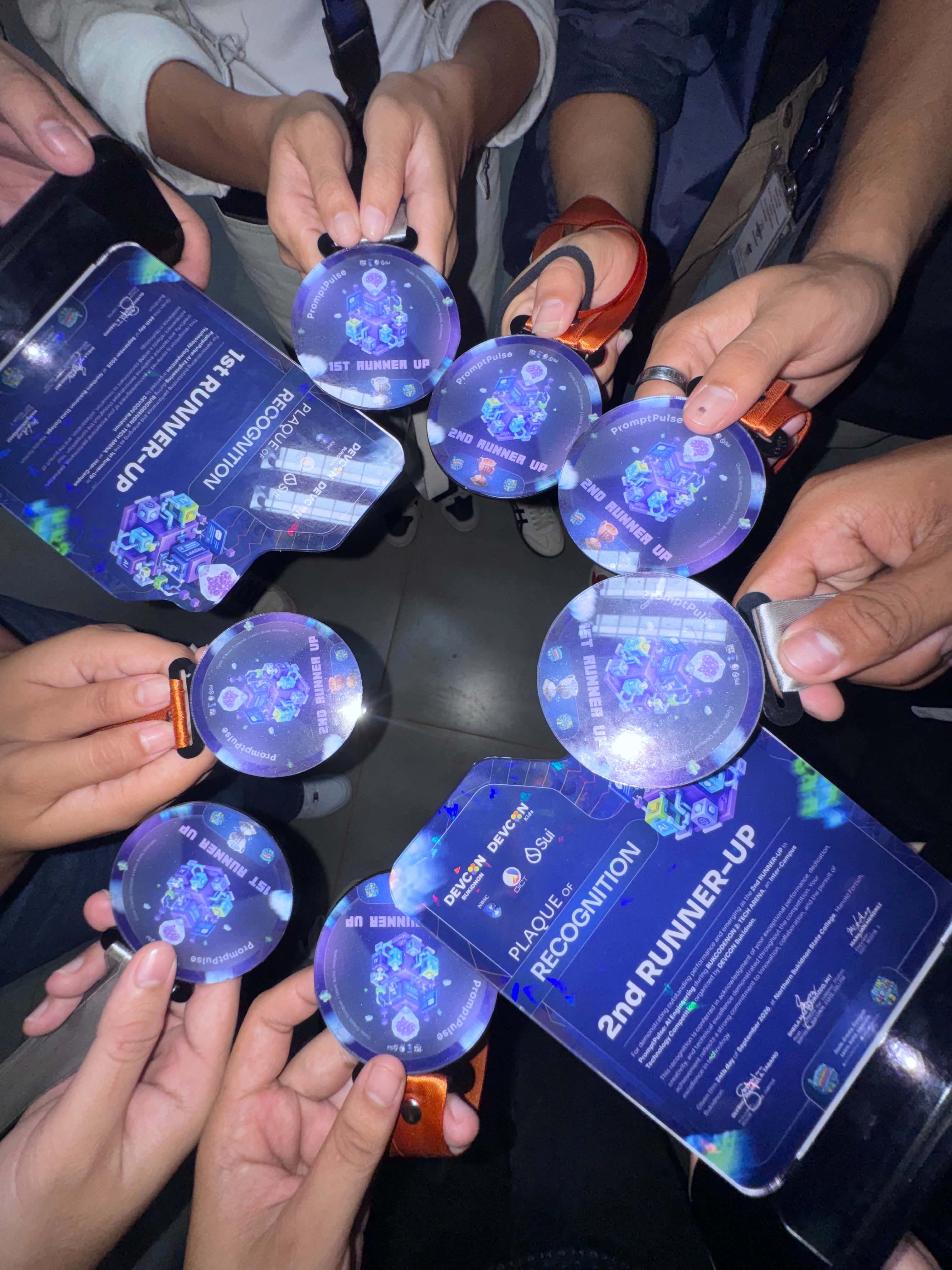PromptPulse competition recognition plaques and medals from the DevCon Bukidnon technology competition