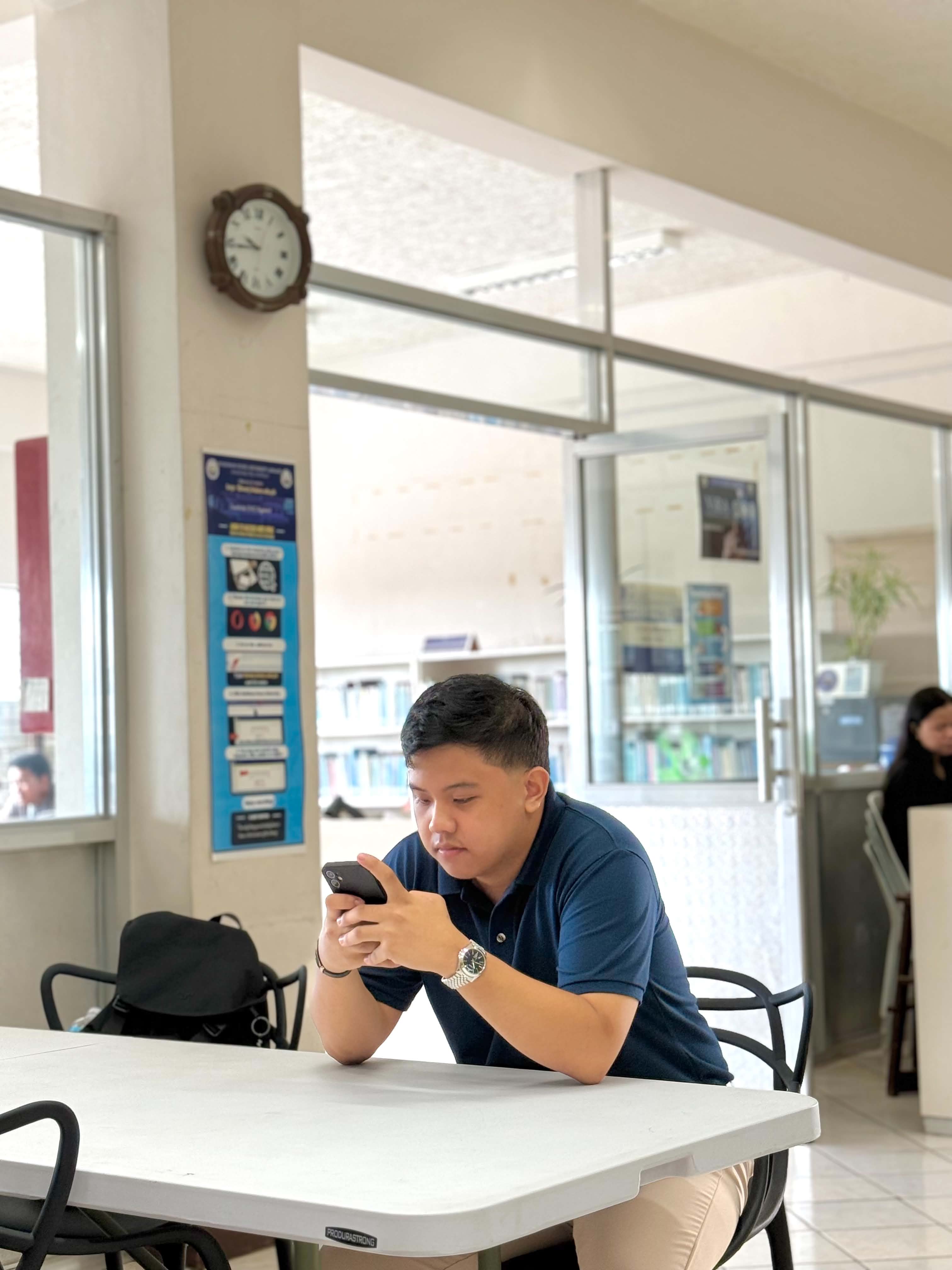 Lyle Agreda working on a software project at a library in Malaybalay City, Bukidnon
